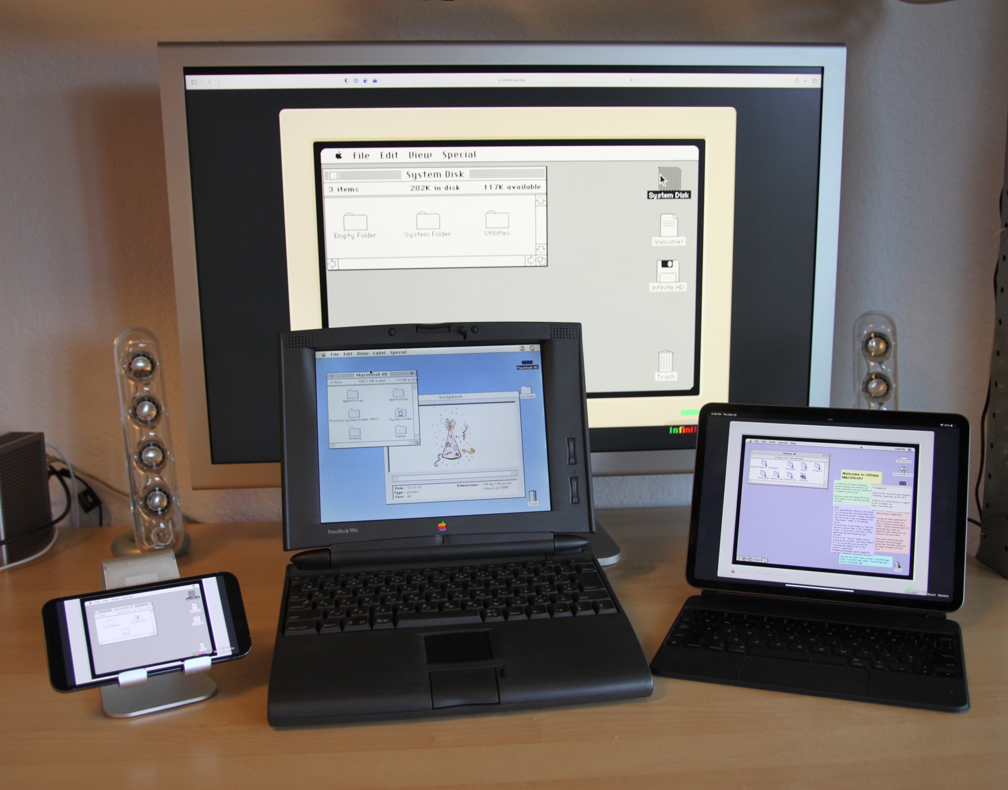 3 emulated Macs and a real one on a desk